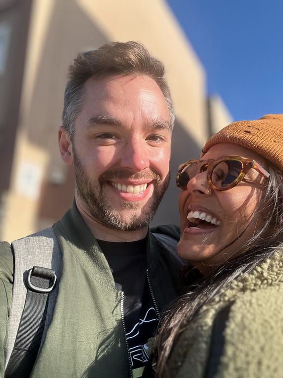 Laughing in the sun while waiting for the Muni