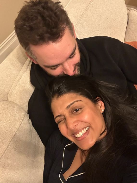 Cuddled up together on the couch