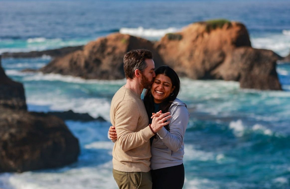 Embracing on a bluff above the sea stacks of the Mendocino coast